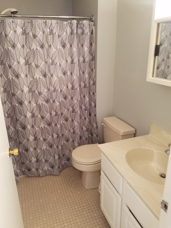 174 Lowell Road, Unit 82 Mashpee, MA 02649 - Photo 8 of 16 a bathroom with a sink and a toilet