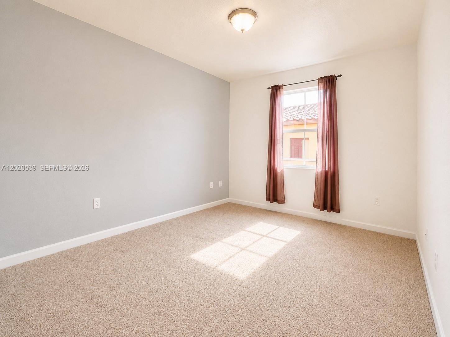 17001 Southwest 96th Street Miami, FL 33196 - Photo 11 of 23 an empty room with windows
