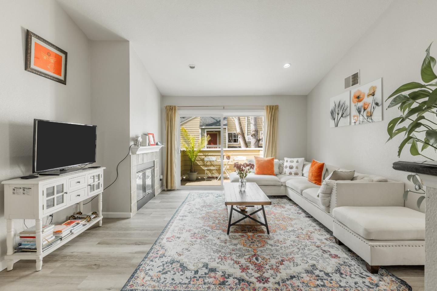 225 Reflections Drive, Unit 27 San Ramon, CA 94583 - Photo 1 of 1 a living room with furniture and a flat screen tv
