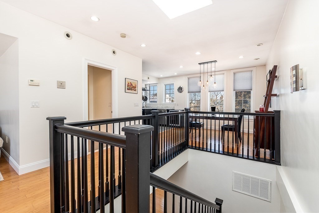 151 G Street, Unit 3 Boston, MA 02127 - Photo 11 of 33 a view of a hallway with windows