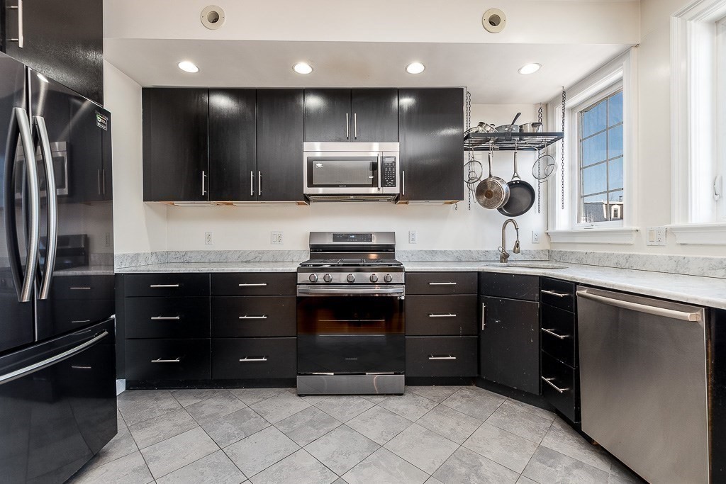 151 G Street, Unit 3 Boston, MA 02127 - Photo 16 of 33 a kitchen with a refrigerator and a sink