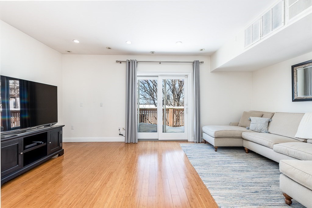 151 G Street, Unit 3 Boston, MA 02127 - Photo 2 of 33 a living room with furniture and a flat screen tv