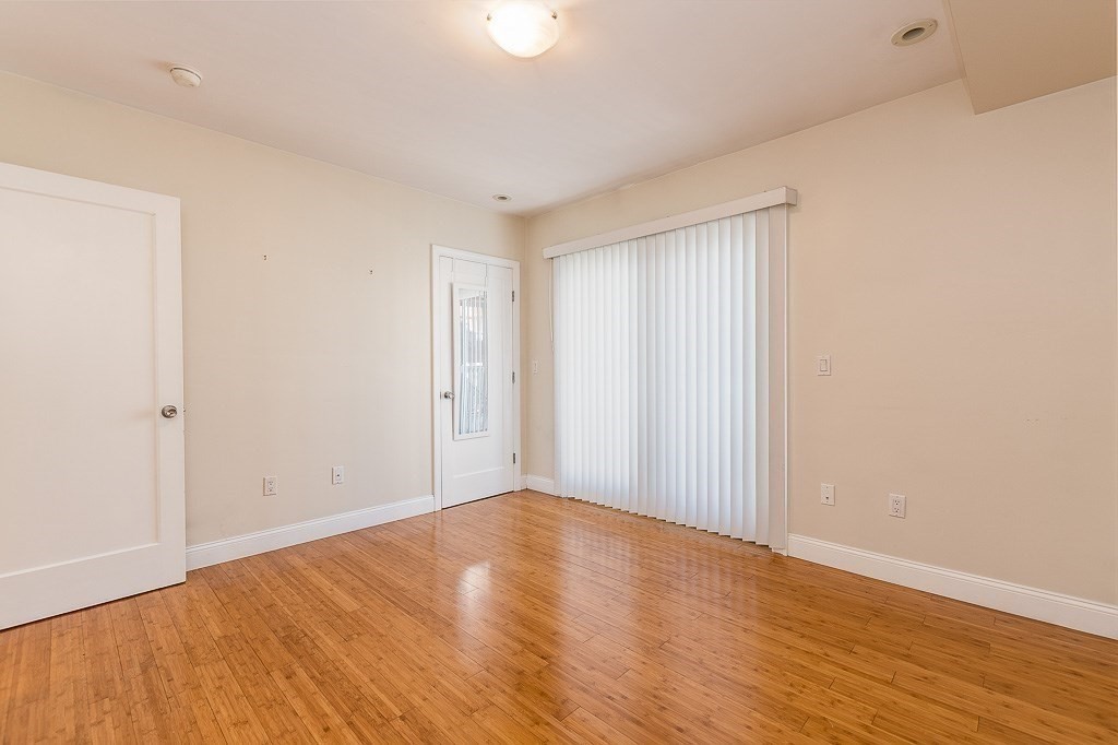 151 G Street, Unit 3 Boston, MA 02127 - Photo 23 of 33 a view of an empty room with wooden floor