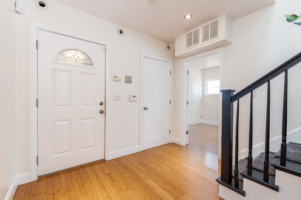151 G Street, Unit 3 Boston, MA 02127 - Photo 26 of 33 a view of a hallway with wooden floor and entryway