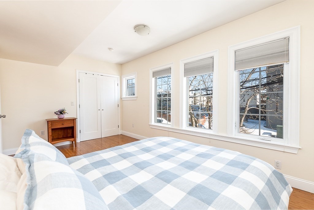 151 G Street, Unit 3 Boston, MA 02127 - Photo 29 of 33 a bedroom with a bed and a large window