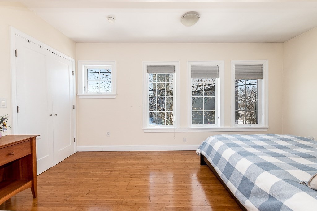 151 G Street, Unit 3 Boston, MA 02127 - Photo 30 of 33 a view of a bedroom with wooden floor and windows