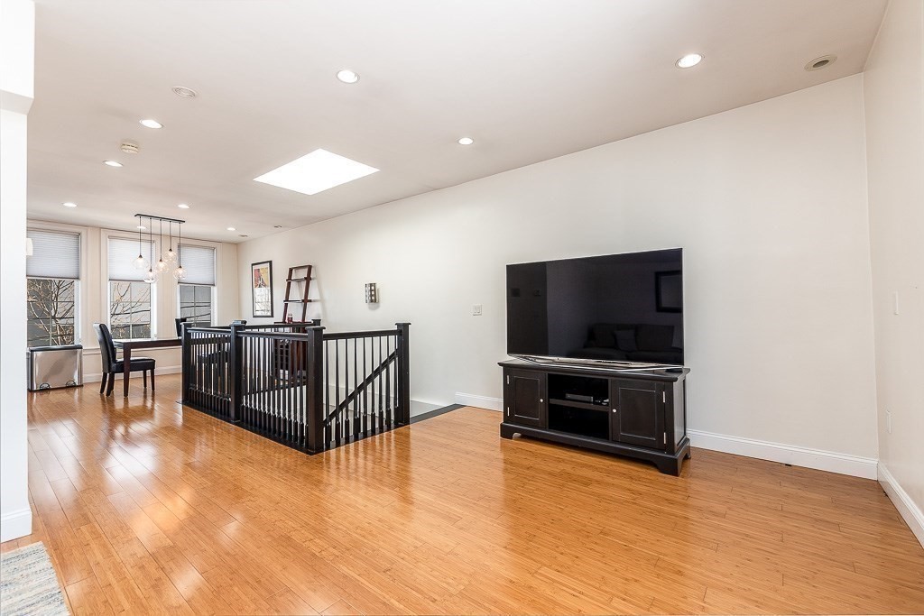 151 G Street, Unit 3 Boston, MA 02127 - Photo 8 of 33 a living room with furniture and a flat screen tv