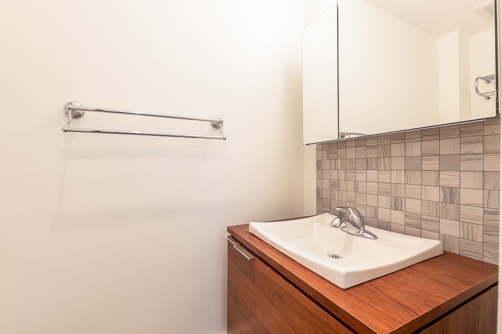 151 G Street, Unit 3 Boston, MA 02127 - Photo 9 of 33 a bathroom with a sink and a mirror