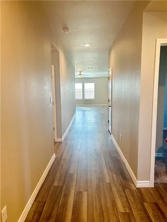 a view of gallery with wooden floor