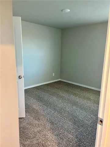 an empty room with a bench