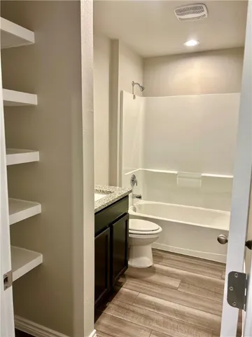 a bathroom with a toilet a sink and bathtub
