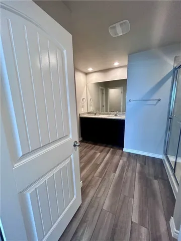 a view of gallery with wooden floor