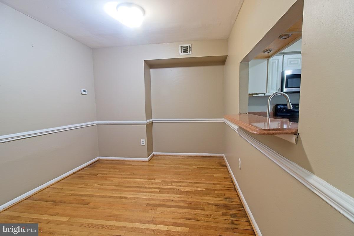 9054 Canterbury Riding, Unit 147 Laurel, MD 20723 - Photo 5 of 15 a view of an empty room with a window