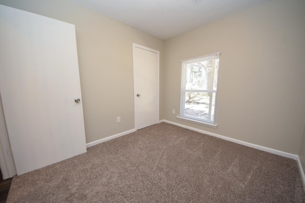 1618 Mathis Road Drummonds, TN 38023 - Photo 8 of 11 Empty room featuring carpet flooring