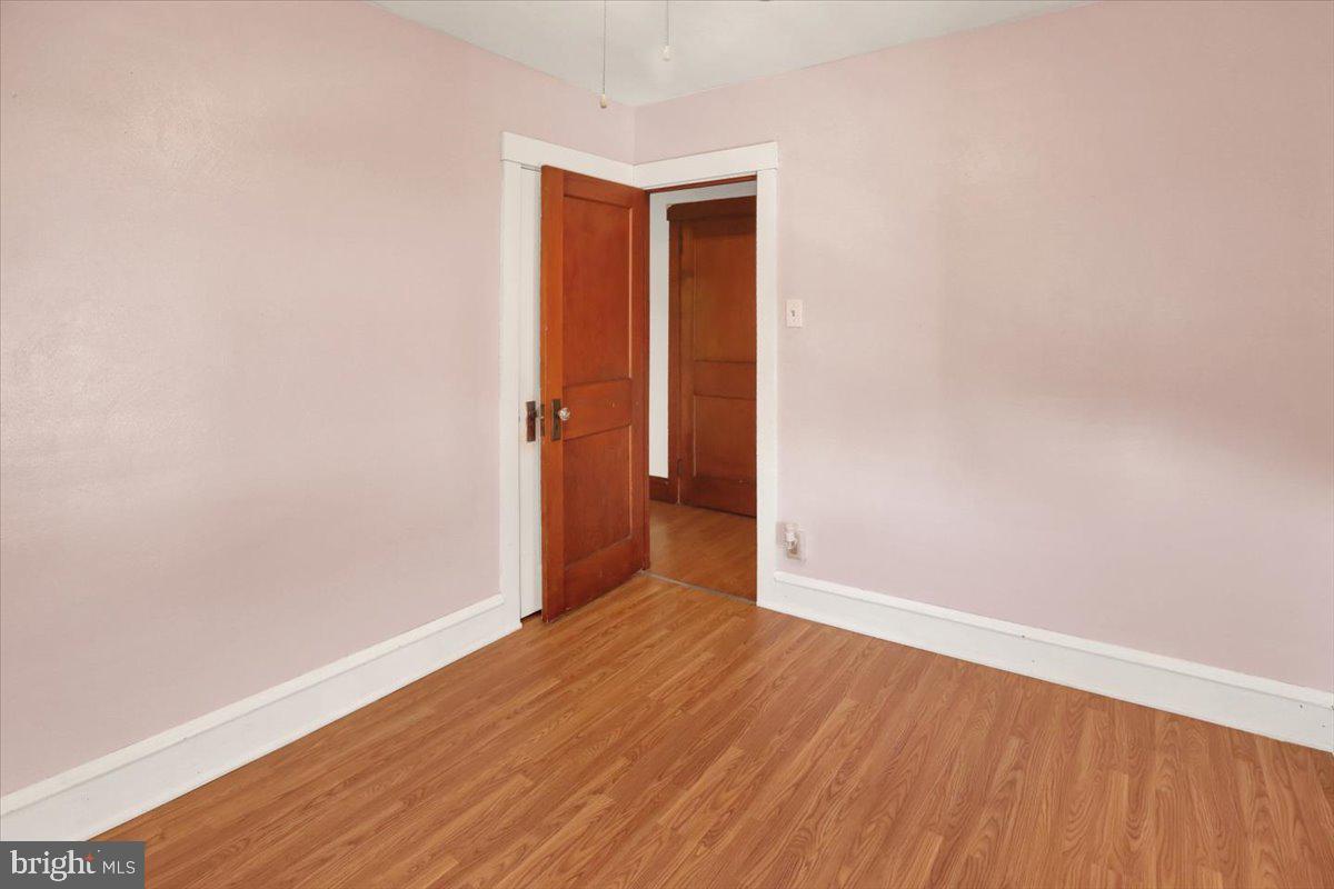 29 Arlington Street Reading, PA 19611 - Photo 18 of 32 a view of an empty room with wooden floor