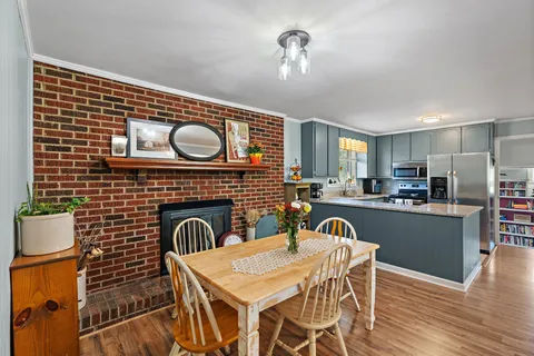 a view of kitchen and dining area with furniture