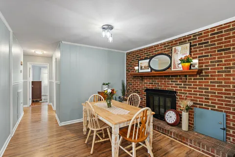 a view of a livingroom with furniture and a fireplace