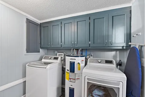 a view of storage and utility room with washer and dryer