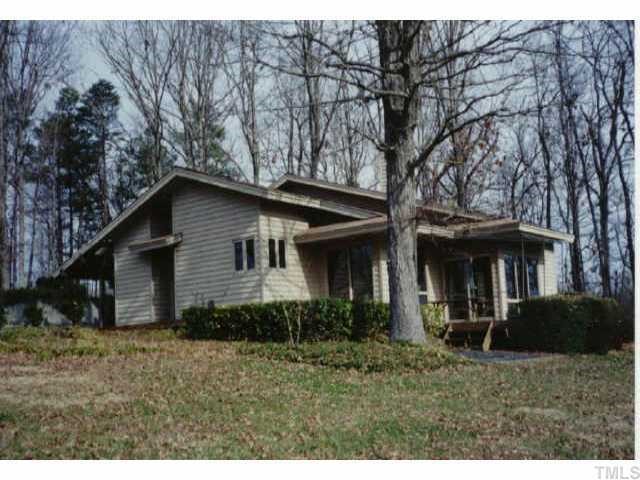 1810 Terry Road Durham, NC 27712 - Photo 1 of 1 a house that has a tree in front of it