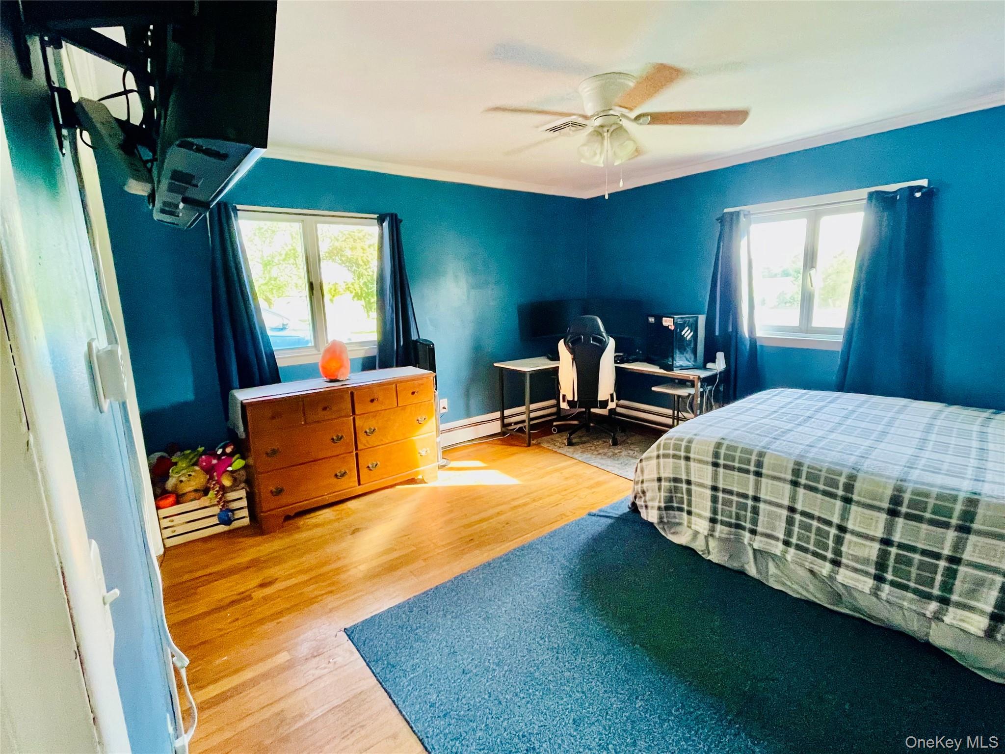 137 Cross Road Goshen, NY 10924 - Photo 18 of 50 a bedroom with a bed and wooden floor