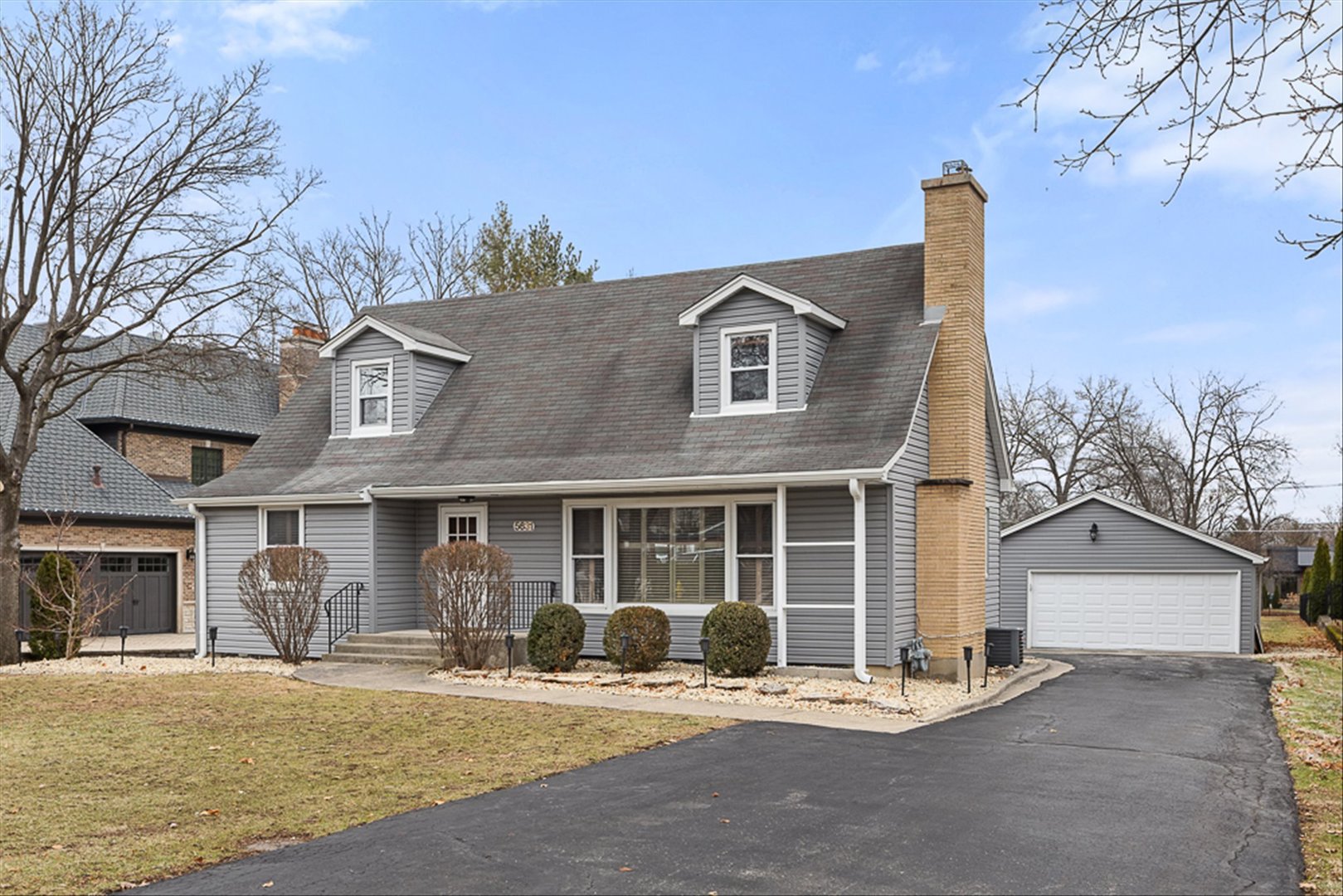 5631 South Oak Street Hinsdale, IL 60521 - Photo 2 of 38 a front view of a house with outdoor seating