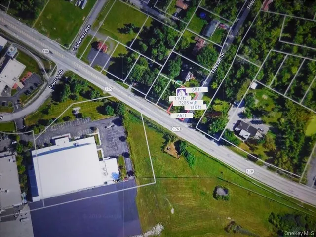 an aerial view of a house with a garden and swimming pool