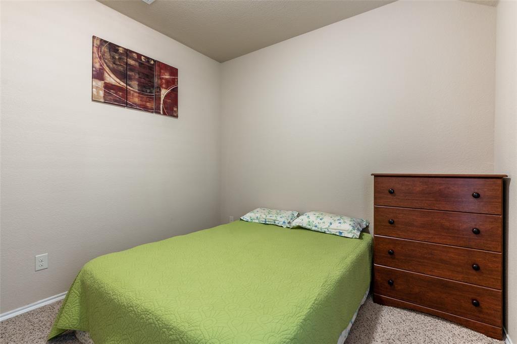 504 Rocky Pine Road McKinney, TX 75072 - Photo 27 of 36 Carpeted bedroom with baseboards
