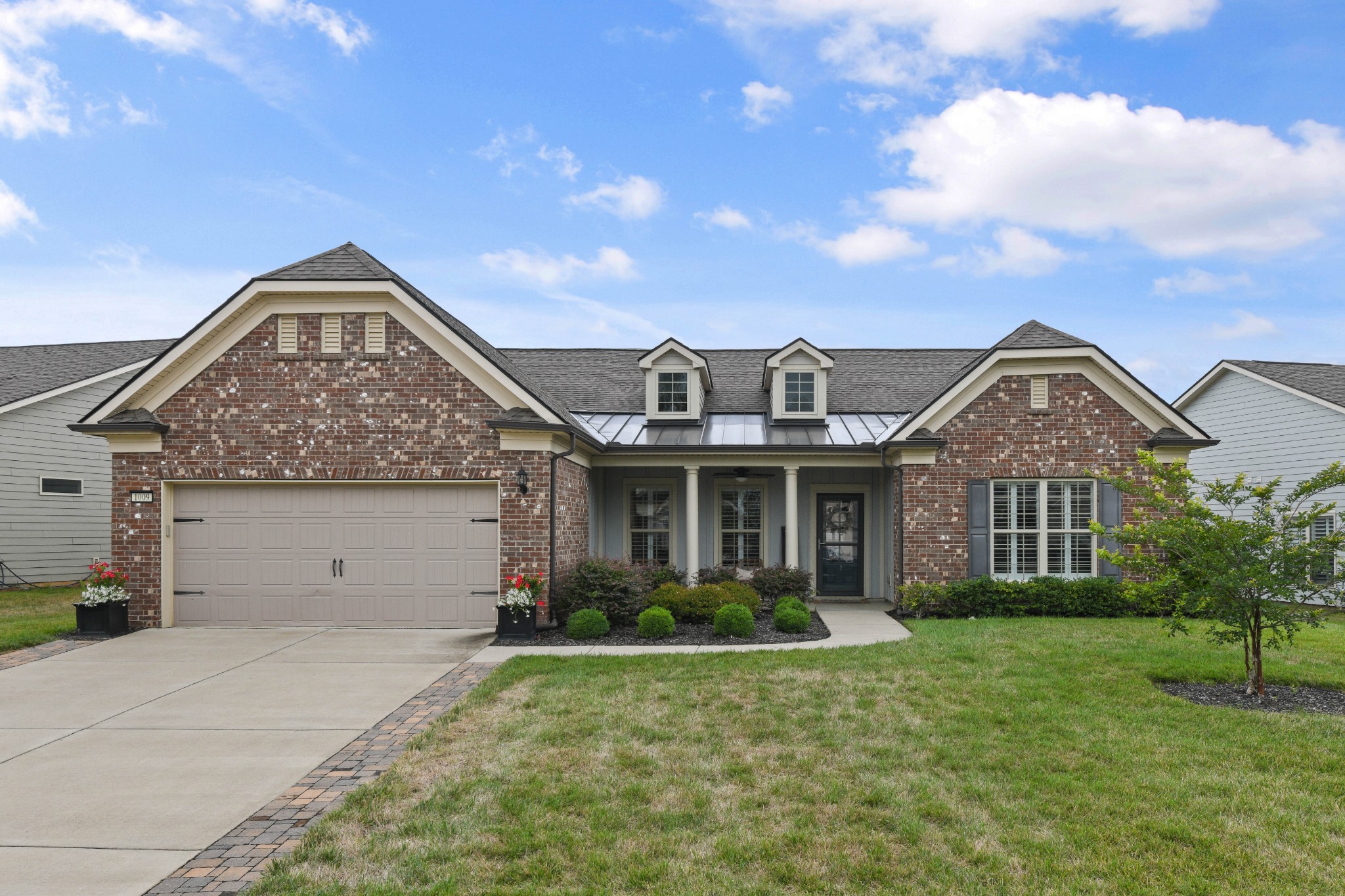 a front view of a house with garden