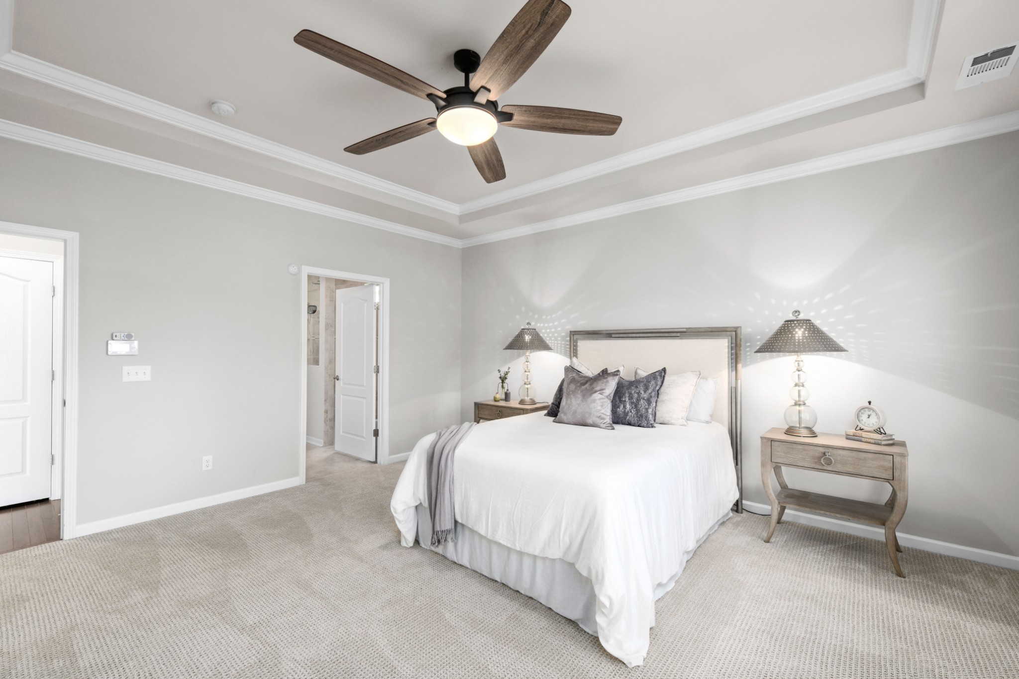1009 Coffee Ridge Spring Hill, TN 37174 - Photo 18 of 53 a bedroom with a large bed and a ceiling fan
