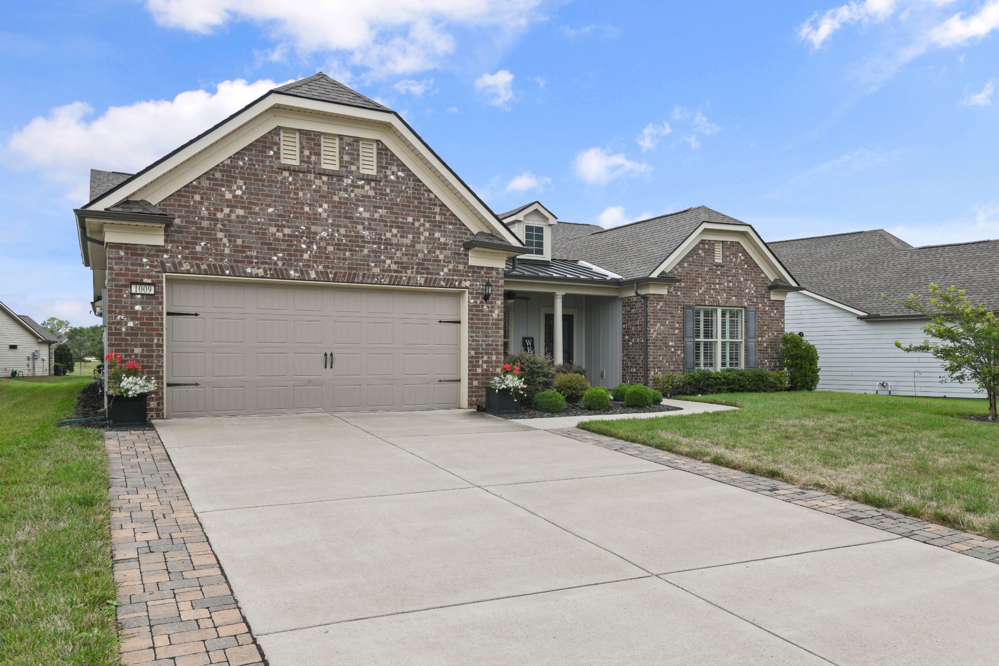 1009 Coffee Ridge Spring Hill, TN 37174 - Photo 2 of 53 a front view of a house with garden