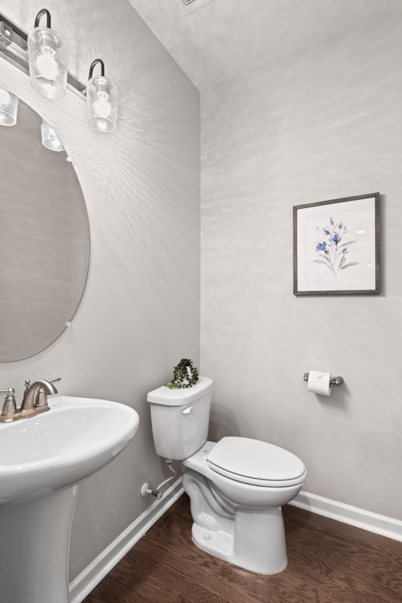 1009 Coffee Ridge Spring Hill, TN 37174 - Photo 32 of 53 a white toilet sitting next to a bathroom sink