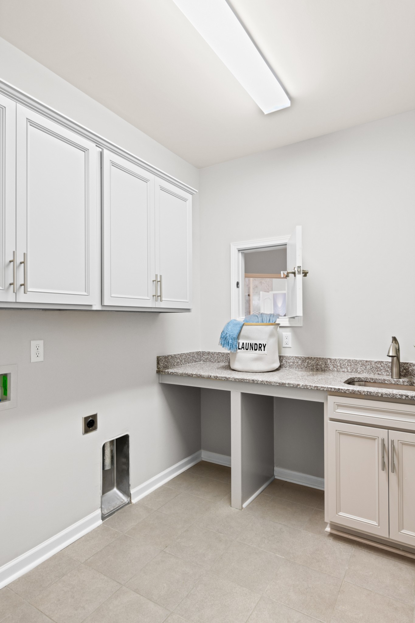 1009 Coffee Ridge Spring Hill, TN 37174 - Photo 37 of 53 a kitchen with stainless steel appliances granite countertop a sink and a stove