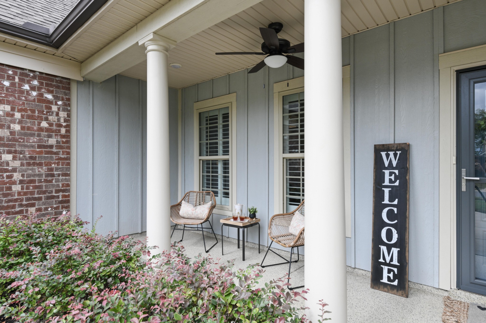 1009 Coffee Ridge Spring Hill, TN 37174 - Photo 4 of 53 front view of a house with chairs and table in a patio