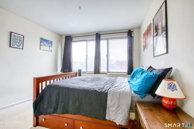 a bathroom with a sink toilet vanity and shower