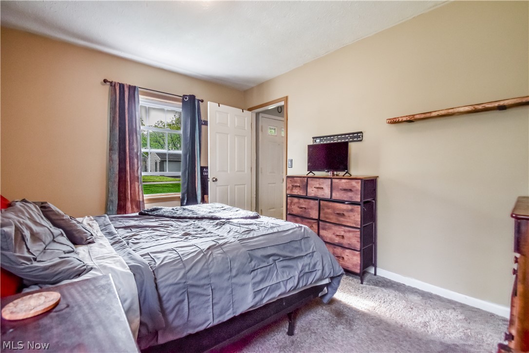 1969 Paisley Road Madison, OH 44057 - Photo 10 of 20 Carpeted room with a double-paned window
