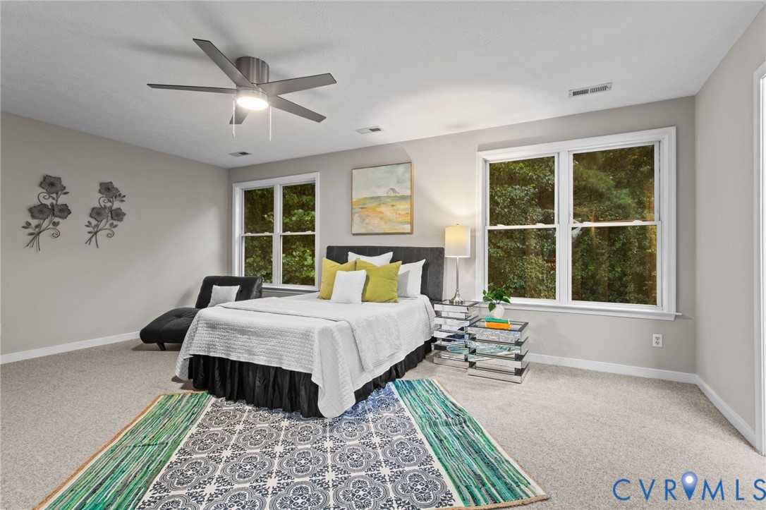 10710 Courthouse Road Dinwiddie, VA 23841 - Photo 24 of 48 a bedroom with a large bed and a window