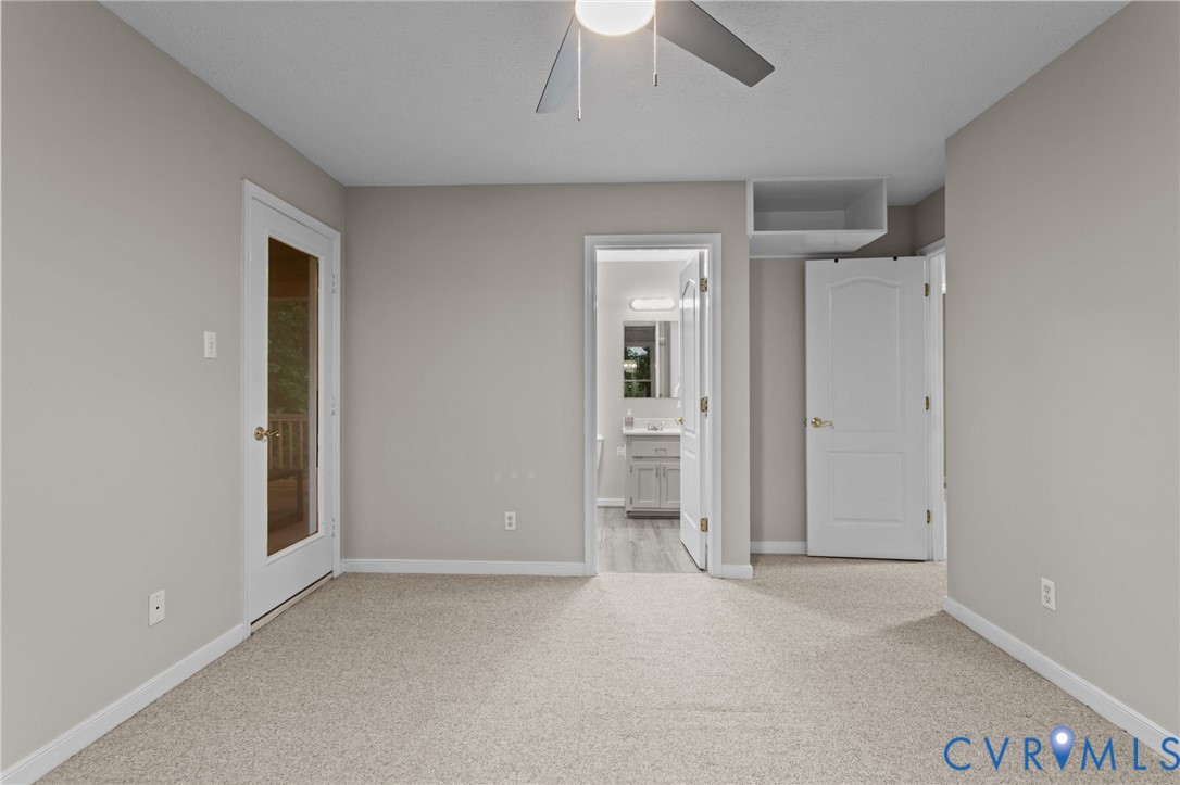 10710 Courthouse Road Dinwiddie, VA 23841 - Photo 31 of 48 an empty room with closet and a hallway