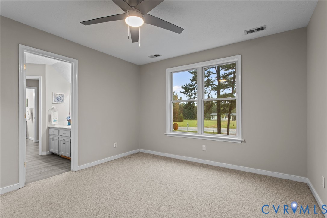 10710 Courthouse Road Dinwiddie, VA 23841 - Photo 34 of 48 an empty room with windows and closet