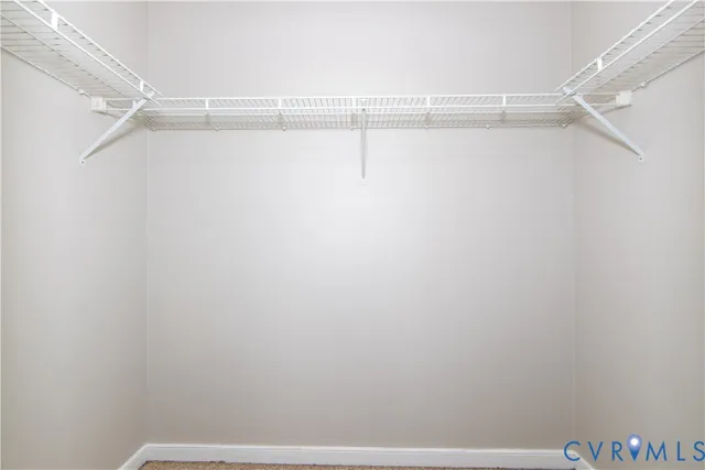 a bathroom with a double vanity sink a mirror and shower