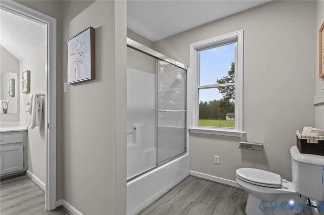 a bathroom with a double vanity sink mirror and cabinets