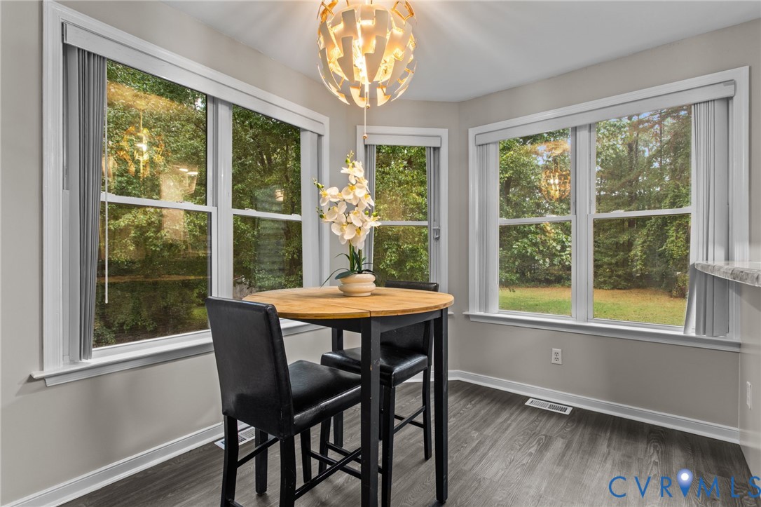 10710 Courthouse Road Dinwiddie, VA 23841 - Photo 8 of 48 a dining room with furniture window and wooden floor