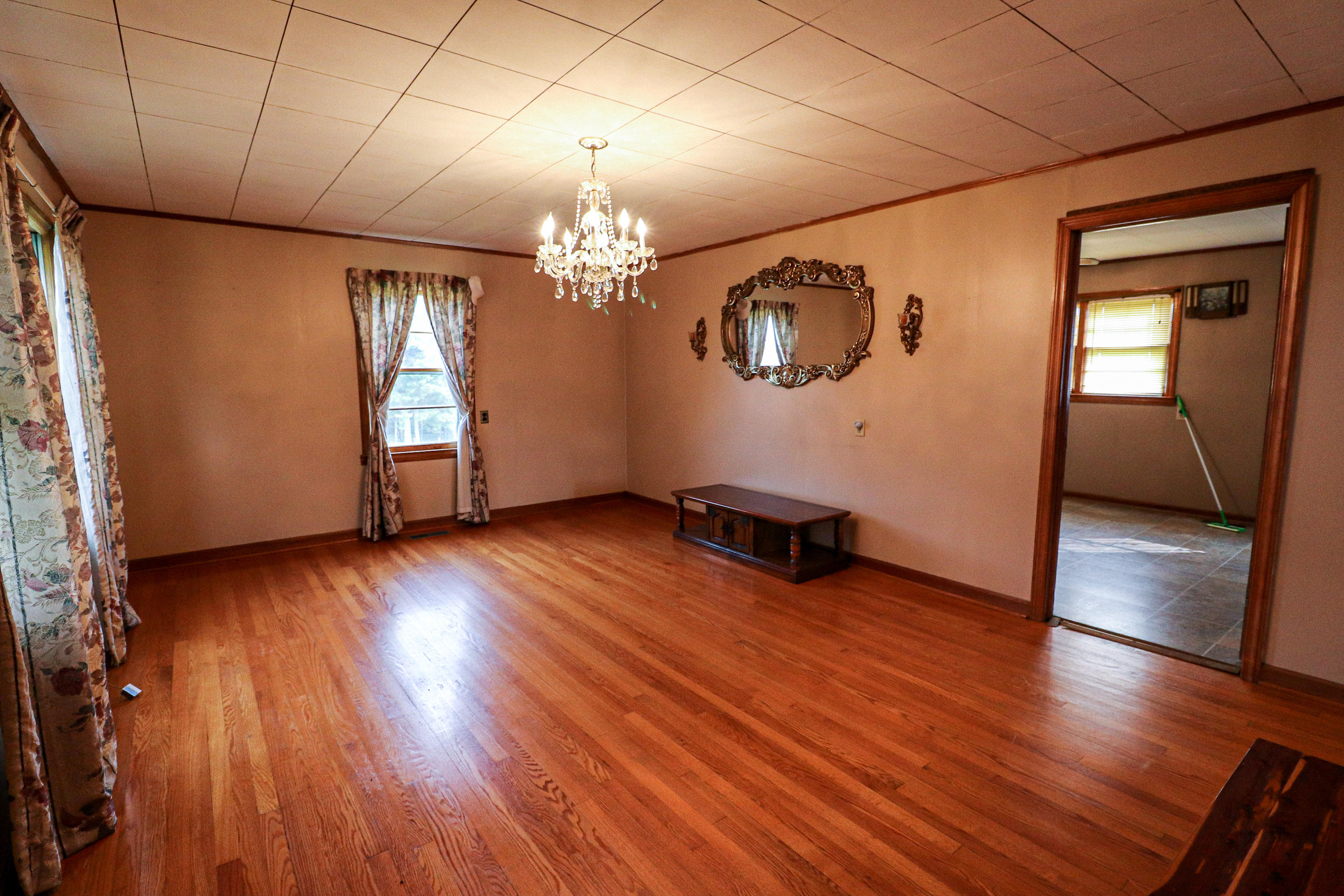 1040 Eanes Road Northeast Check, VA 24072 - Photo 12 of 17 an empty room with wooden floor chandelier and windows