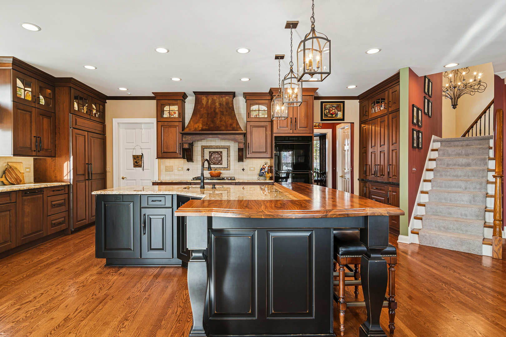 1520 MacAlpin Circle Inverness, IL 60010 - Photo 12 of 58 a kitchen with stainless steel appliances granite countertop a sink a stove and a wooden floors