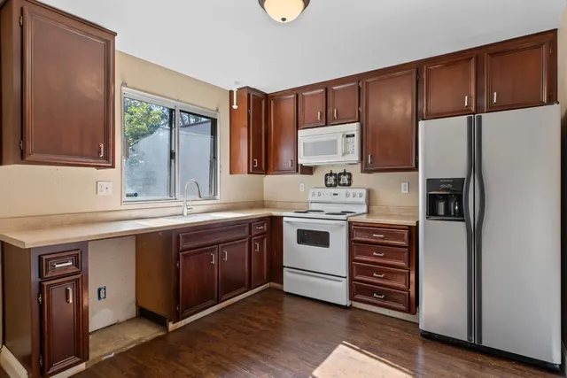 a view of a hallway with a shower and a room