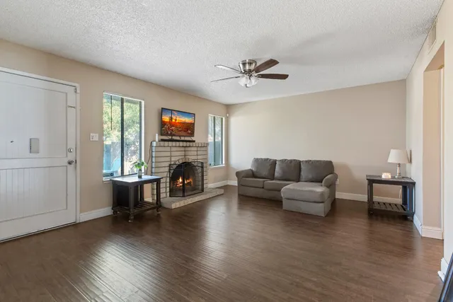 a view of a livingroom with furniture and a flat screen tv