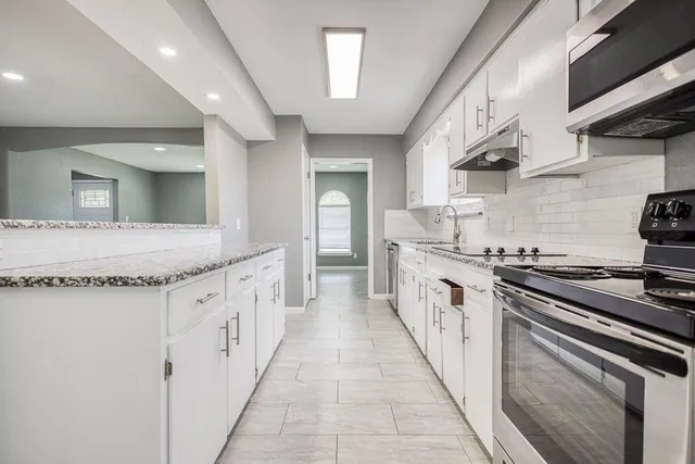 a bathroom with a sink double vanity and a mirror