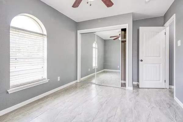 a bathroom with a sink a mirror and a chandelier