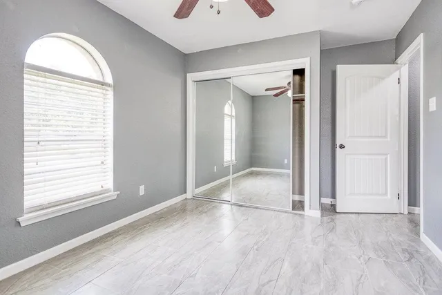 a bathroom with a sink a mirror and a chandelier