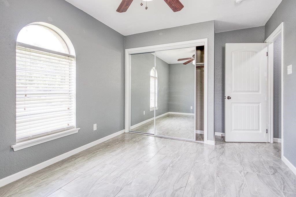 1810 Marlin Street Portland, TX 78374 - Photo 23 of 32 an empty room with windows and closet