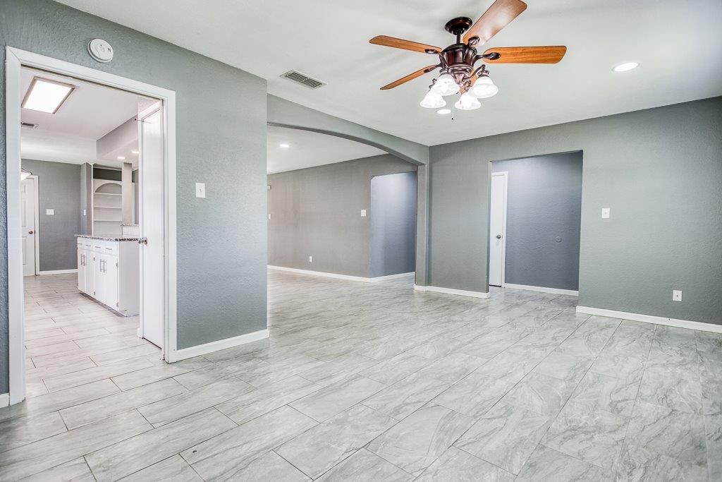 1810 Marlin Street Portland, TX 78374 - Photo 5 of 32 a view of a room with a chandelier fan and windows
